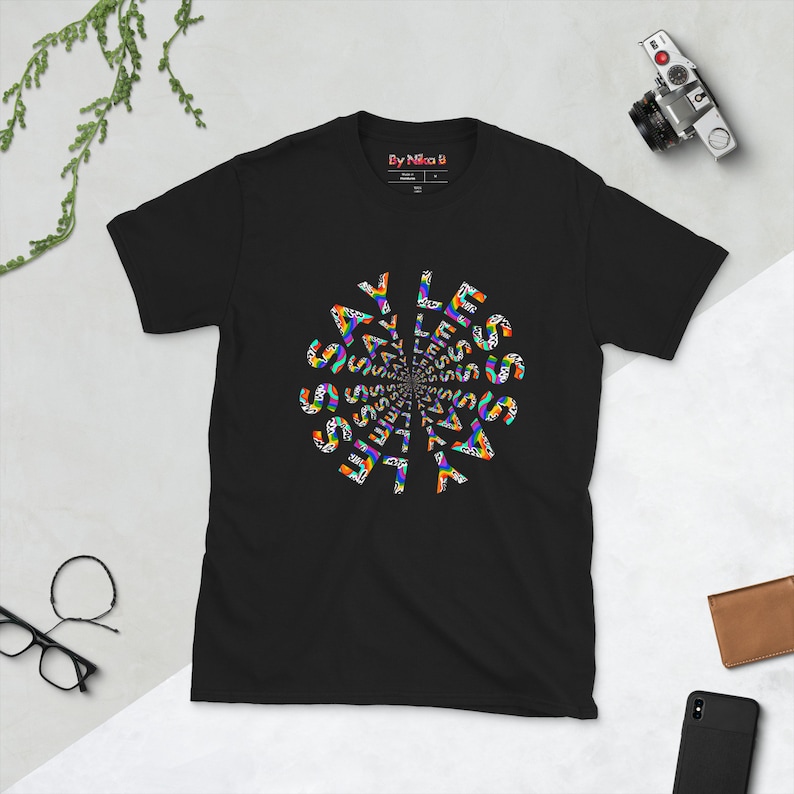 Kaleidoscope Tee — Black · flat lay, artwork by Nika B